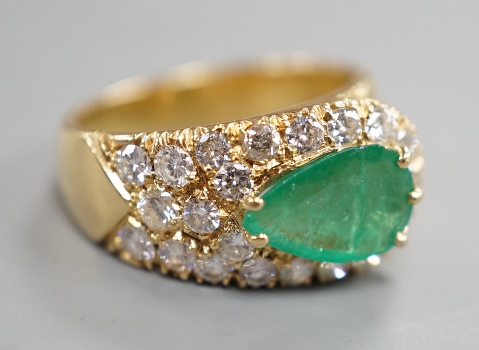 A modern yellow metal, pear cut emerald and diamond cluster set dress ring, size H, gross weight 5.1 grams.